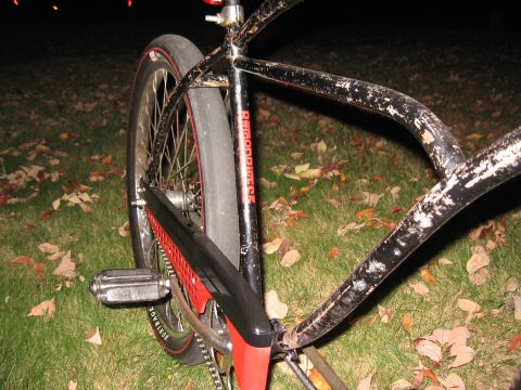 1994 Ford Bronco - Close-up view of a black bicycle frame with visible red accents and 'REDLINE' branding on the seat tube.