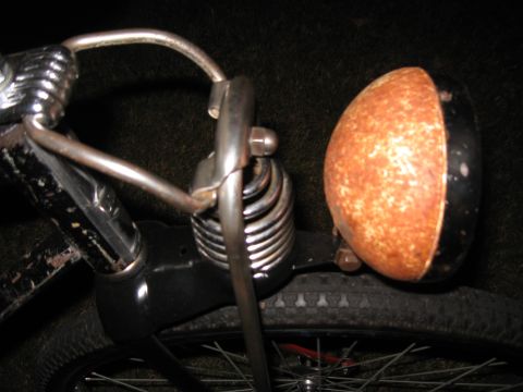 1994 Ford Bronco - A vintage bicycle's rusty headlight and suspension fork are visible in this close-up shot.