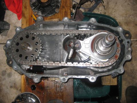 1994 Ford Bronco - The internal components of a vehicle's transfer case are laid out for inspection or repair.