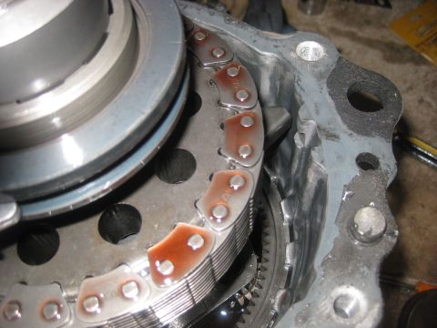 1994 Ford Bronco - Close-up of a vehicle's transfer case internal components, showing a chain and gears.