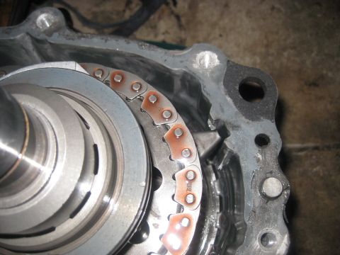 1994 Ford Bronco - Close-up of a transfer case chain and gears, showing the text 'FORCE' on one of the chain links.