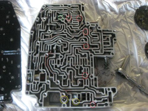 1994 Ford Bronco - Close-up of an automatic transmission valve body, showing its complex internal passages.