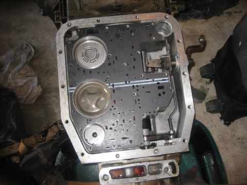 1994 Ford Bronco - Close-up of a transmission valve body, showing internal components and fluid passages.