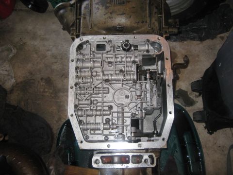 1994 Ford Bronco - Close-up view of a transmission valve body, revealing its complex internal workings.