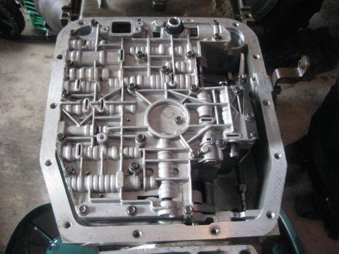 1994 Ford Bronco - Close-up of an automatic transmission valve body, showing its intricate internal structure.