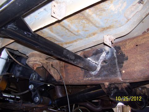 1990 Ford Bronco - Close-up of vehicle undercarriage showing rust and recent welding work on the frame. Date stamp indicates 10/25/2012.