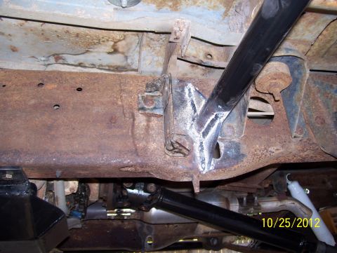 1990 Ford Bronco - Close-up of vehicle undercarriage showing rust and suspension parts, dated 10/25/2012.