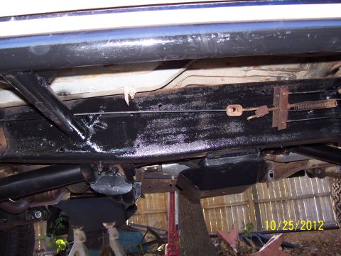 1990 Ford Bronco - The underside of a vehicle's frame and suspension components are visible, with a date stamp indicating the photo was taken on October 25, 2…