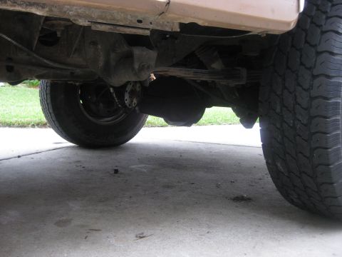 1994 Ford Bronco - Underside view of the rear axle and suspension components on a 1994 Ford Bronco.