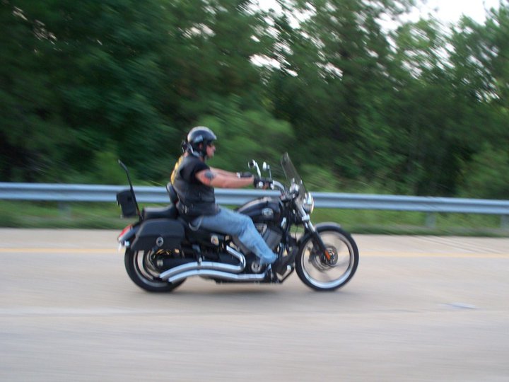 Motorcycle with rider in motion on a road