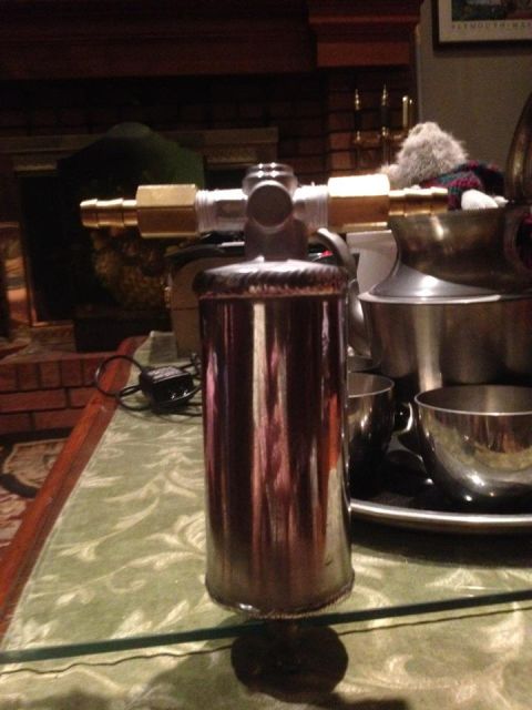 1972 Ford Ranchero - A chrome fuel filter with brass fittings is displayed on a table.