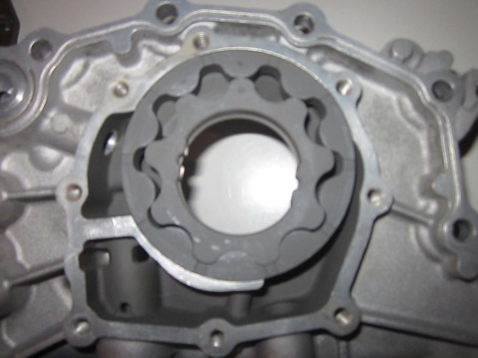 Close-up of an engine oil pump with internal gears