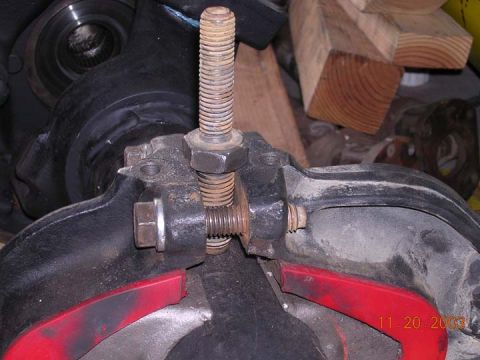 1994 Ford Bronco - A close-up view of a brake caliper adjustment screw and spring, with a date stamp of 11.20.2003 visible.