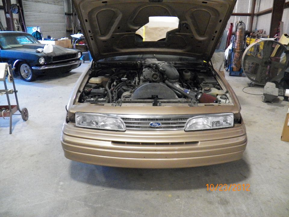 Repaired front bumper on, same grill and new headlights.