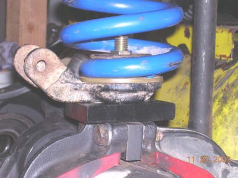 1994 Ford Bronco - bracket with retainer and spring. it adds about 2" over the stock lower 79 reteiner I had with the 79.