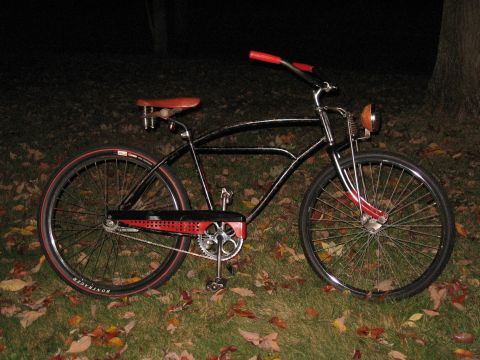 1994 Ford Bronco - Custom cruiser bicycle with red accents sits on a lawn covered in autumn leaves.