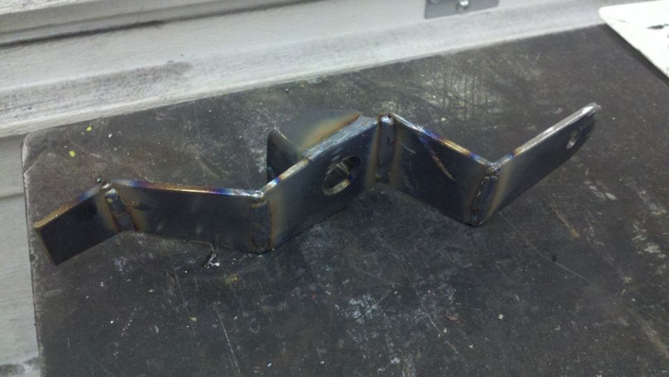 metal bracket with two holes and welded joints