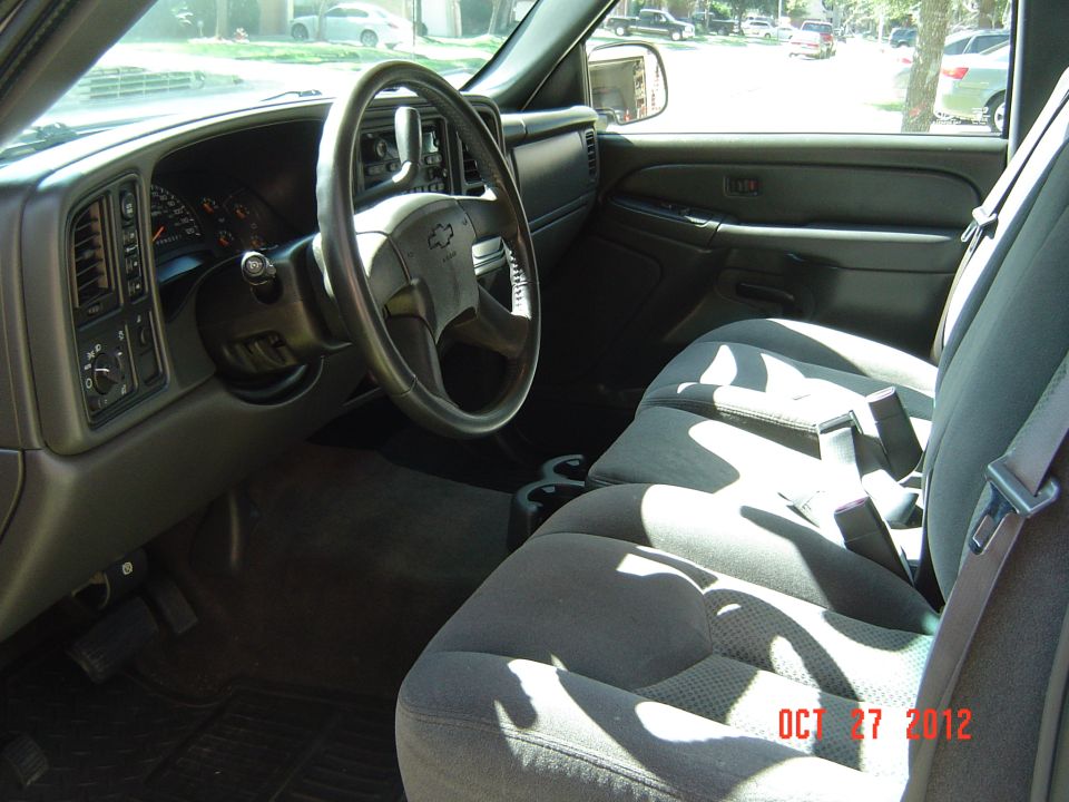 Interior view of a Chevrolet Silverado showing the dashboard, steering wheel, and front seats