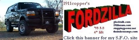 1995 Ford Bronco - A black Ford Bronco with a brush guard and custom graphics is shown from the front, lifted with off-road tires.
