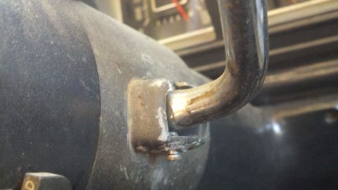 1978 Ford Bronco - Close-up of the steering column support bracket inside a 1978 Ford Bronco.