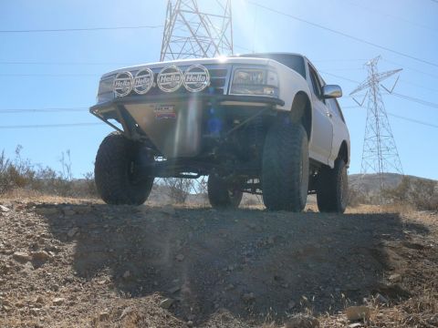1988 Ford Bronco - This modified SUV is equipped for off-road adventures, a lifted suspension and powerful lighting for terrain.