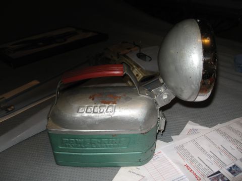 1994 Ford Bronco - A vintage Delta Power-King Hand Lantern is shown with its metal reflector and red handle.