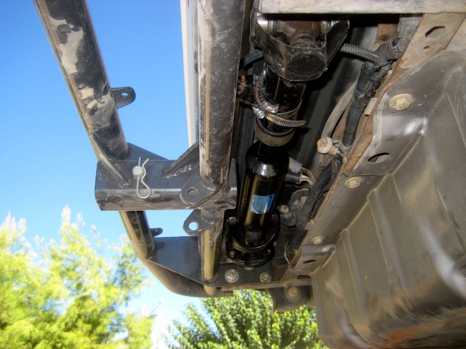 Underbody view of a 1996 Ford Bronco showing driveshaft and fuel tank
