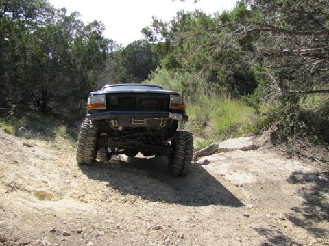 1995 Ford Bronco - This modified Ford Bronco navigates a rocky, off-road path.