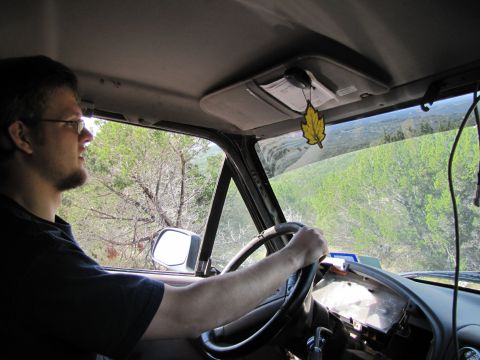 1995 Ford Bronco - Driver's perspective from inside a vehicle, looking out at a rural landscape.