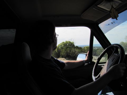 1995 Ford Bronco - Driving through a scenic landscape, looking out the window.