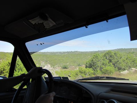 1995 Ford Bronco - Driving through a scenic, green landscape from the interior of a vehicle.