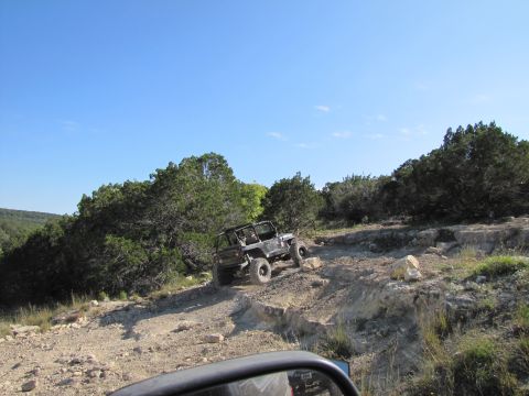 1995 Ford Bronco - Off-roading adventure with a Jeep Wrangler navigating a challenging, rocky terrain.