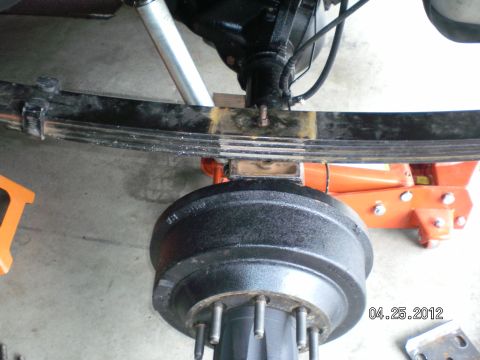 1996 Ford Bronco - Start by removing the shocks lower nut and sliding it off the axle. Then loosen the lug nuts. Jack the truck up as high as your (6-ton) sta…