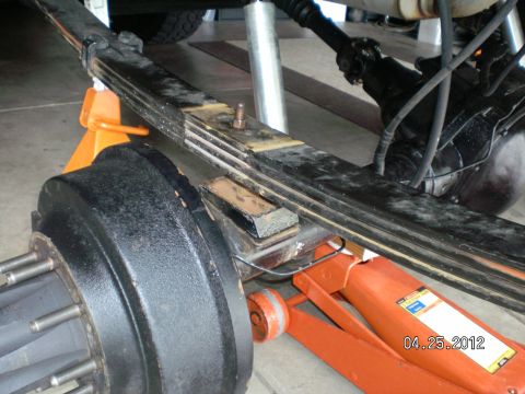 1996 Ford Bronco - Now that the leafs are removed you can lift one end at a time and install the spring plates and the u-bolts and snug the nuts and adjust an…