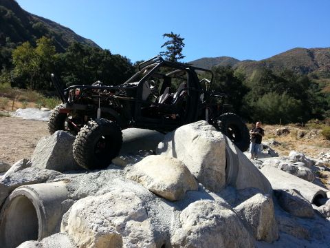 1978 Ford Bronco - Custom off-road buggy with roll cage and large tires is positioned on large rocks.