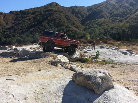 1978 Ford Bronco - 1978 Ford Bronco navigating a rocky off-road course.