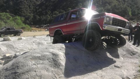 1978 Ford Bronco - 1978 Ford Bronco navigating a rocky off-road course.