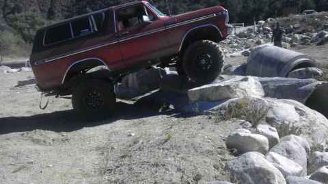 1978 Ford Bronco - 1978 Ford Bronco navigating a rocky obstacle course.