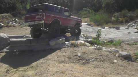 1978 Ford Bronco - 1978 Ford Bronco navigating a rocky off-road course.