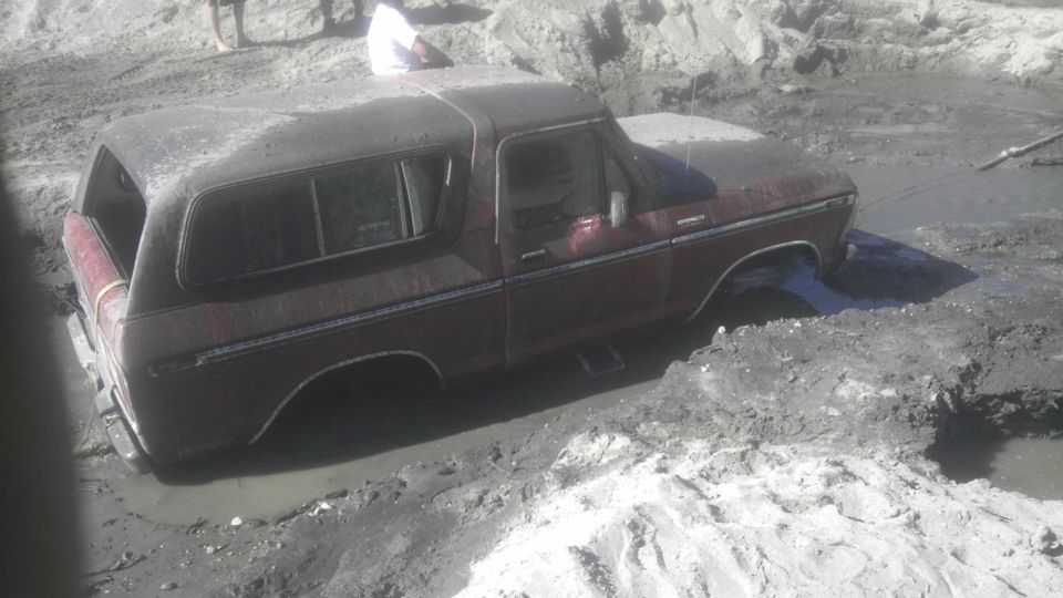 1978 Ford Bronco stuck in mud with rear half submerged