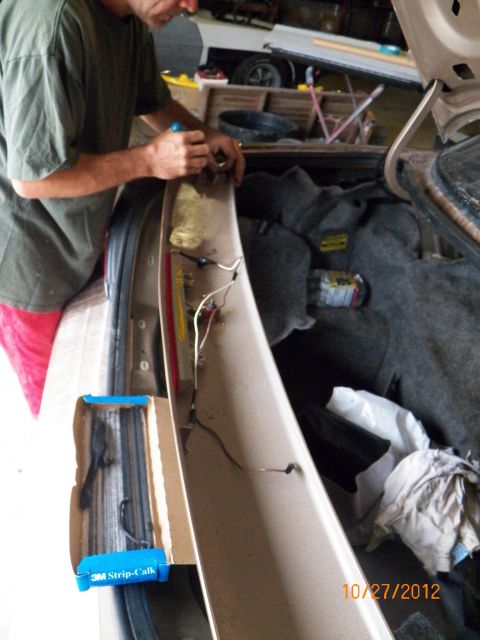 1993 Ford Crown Victoria - Applying 3M Strip-Calk to the studs to prevent water intrusion.