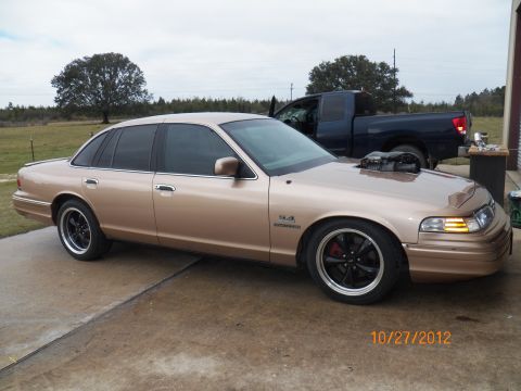 1993 Ford Crown Victoria - Modified 1993 Ford Crown Victoria features a prominent supercharger protruding from the hood.