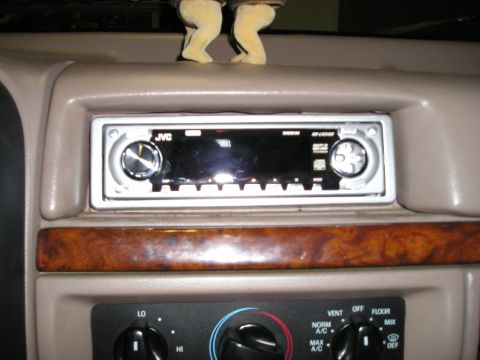 1996 Ford Bronco - Aftermarket JVC CD/MP3 player installed in the dashboard, above climate controls.