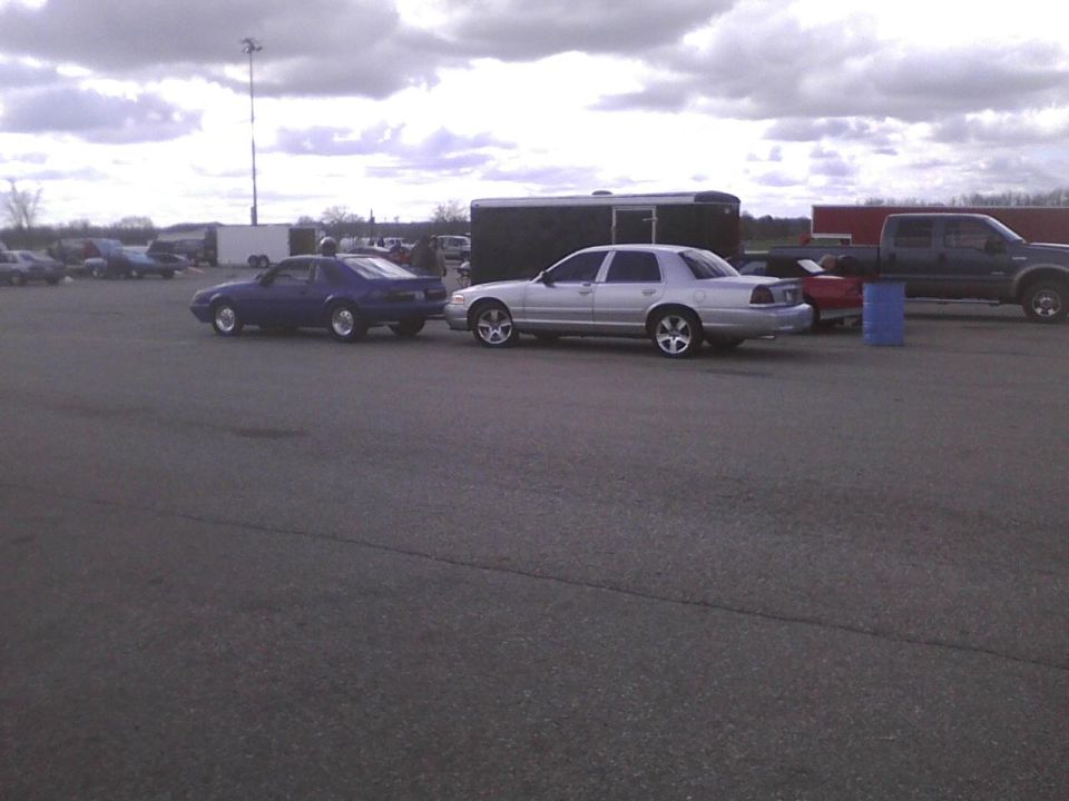 Silver sedan, side view. 2003 Ford Crown Victoria