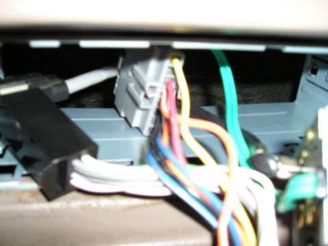 1996 Ford Bronco - Close-up view of a vehicle's wiring harness, likely for an aftermarket installation.