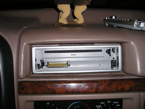 1996 Ford Bronco - Interior view of a 1996 Ford Bronco showing the CD player opening and its wiring harness.
