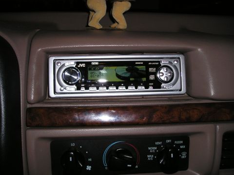 1996 Ford Bronco - Interior view of a JVC car stereo and climate controls in a vehicle dashboard.