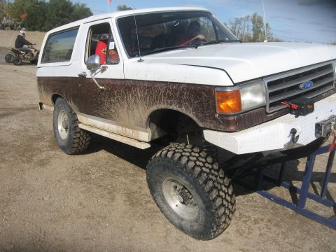 1987 Jeep Comanche - This two-tone Ford Bronco is equipped for off-road adventures, large tires and a winch on the front bumper.