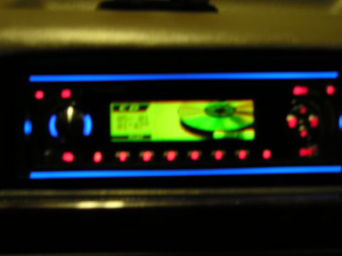 1996 Ford Bronco - Aftermarket car stereo installed, showing CD playback on its screen.
