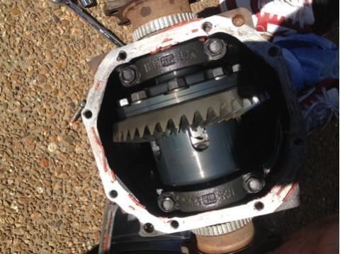 1996 Ford Bronco - Close-up of internal differential gears and housing, with a wrench visible in the background.